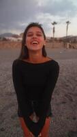 A Joyful Woman Happily Enjoying a Beach Day Surrounded by Lush Palm Trees and Nature video