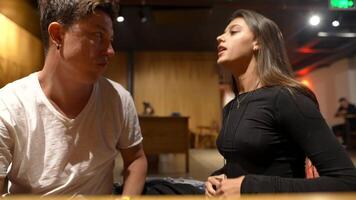 An Intense and Engaging Conversation in a Vibrant Modern Cafe Setting Filled with Life video