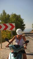 A Rider on a Colorful Scooter Enjoying the Beautiful Scenic Bend During a Summer Day video