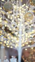 An Elegant Illuminated Holiday Tree adorned with Beautiful Festive Ornaments and Lights video