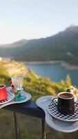 Enjoying a Scenic Morning Coffee by the Beautiful Lake as the Sun Rises in the Sky video