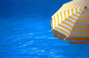 Vibrant Electric Blue Waters of a Serene Lake Under a Clear Sky photo