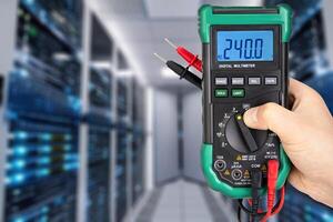 Digital Multimeter Displaying Voltage in Data Center photo