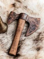Rustic axe on fur background photo