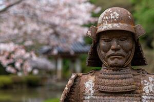 ancient samurai warrior statue in spring garden photo