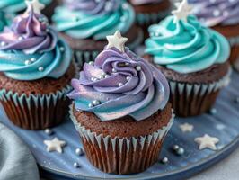 Whimsical galaxy themed cupcakes with swirled frosting and star decorations photo
