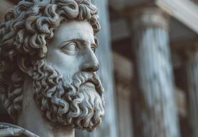 Detailed sculpture of a pensive figure with curly hair and beard photo