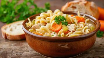 Hearty chicken noodle soup in a rustic bowl photo