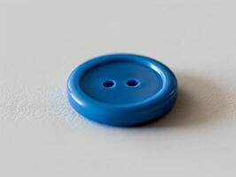 blue button on a textured surface photo
