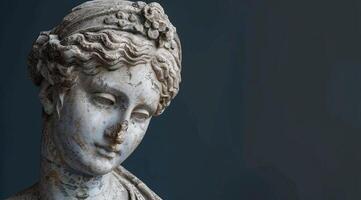 Weathered stone statue of a classical figure photo