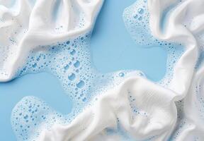 Bubbles and Foam on a Soft Blue Background photo