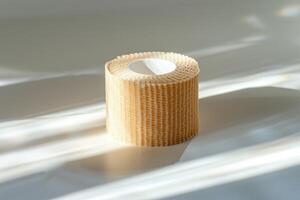 Bandage roll on a reflective surface photo