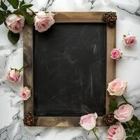Rustic chalkboard frame with pink roses photo