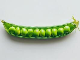 Fresh green pea pod on white background photo