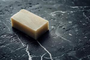 Closeup of a block of parmesan cheese on a dark background photo