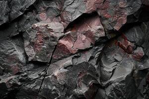 Textured rock surface with cracks and crevices photo