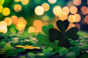 Glittering shamrocks on a green background with blurred lights photo