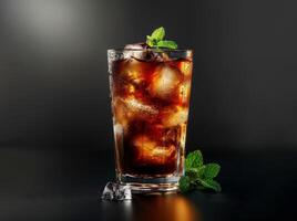 refreshing iced cola drink with mint leaves photo