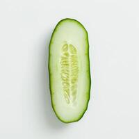 Sliced green cucumber on white background photo