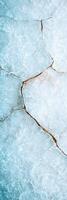 Cracked ice surface with intricate patterns photo