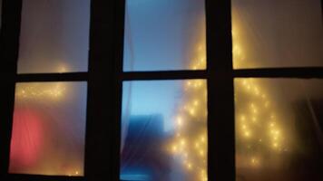 A Room Decorated For Christmas Beyond The Fogged Window video