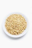 Oat Kernel Bowl on Wooden Background photo