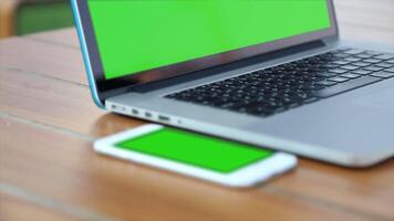Laptop with Green Screen on Table Editable Scene for Creative Projects Digital Design Technology and Customizable Background for Professional Use video
