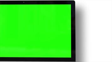 A laptop computer with a green screen on it, ideal for app design, digital content creation, and product mockup presentations. video