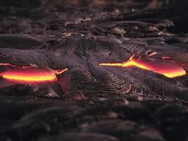 Molten Lava Flow with Intense Fire in Natural Background photo