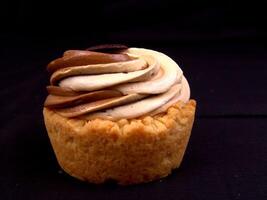 Cupcake with Toppings on Black Background photo