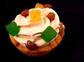 Cupcake with Toppings on Black Background photo