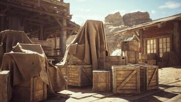 Abandoned wooden crates covered with tarps in a dusty settlement under sunlight video