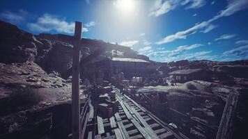Abandoned mining town in a desert landscape under bright, sunny skies video