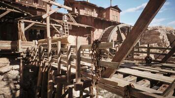 Detailed view of an old wooden watermill structure in a rustic setting video