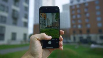 China, Beijing - September 15, 2023. Close-up of iPhone 15 Pro screen with camera shooting. Action. Person holds phone and tries shooting modes with zoom effect. Phone screen taking pictures of video