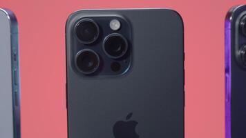 New York - September 15, 2023. iPhones of different generations in comparison. Action. Comparison of new iPhone 15 with versions 14 and 13 generations. Design of iPhones 13, 14 and 15 promax versions video
