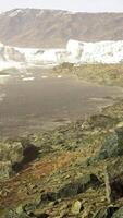 Blue icebergs of Antarctica with frozen and snow covered Antarctic scenery video