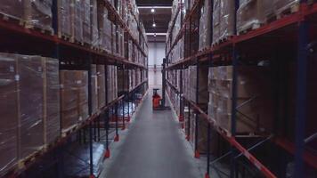 Warehouse with cardboard boxes inside on pallets racks, logistic center. Creative, Huge, large modern warehouse. video