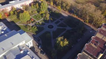 Pattern of park paths near building. Clip. Top view of courtyard landscape with park near buildings. Lines of paths for pedestrians in landscape of yard with park video