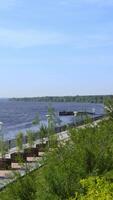 A scenic riverside pathway surrounded by greenery, ideal for relaxation and exploration. Clip video