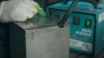 Close up of processing welds process. Creative. Worker putting protective solution against corrosion. video