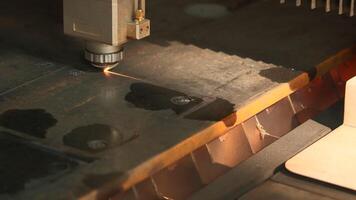 The process of cutting parts from a sheet of metal using a CNC machine. Creative. Metal laser cutting technology. video