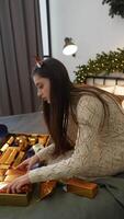 Enjoy the joy of unwrapping gifts in a warm, cozy indoor setting filled with cheer video