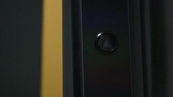 Elevator lift button and person. Concept. Close-up of elevator button with opening doors and person. Man on elevator with call button video