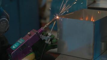 Steel welding, technician working on metal with welding machine in factory while wearing safety equipment. Creative. Construction maintenance service by manual skill labor concept. video