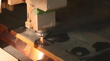 The process of cutting parts from a sheet of metal using a CNC machine. Creative. Metal laser cutting technology. video