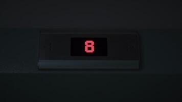 Display of an elevator going down indicating the floor number passing. Concept. LED screen, interior. video