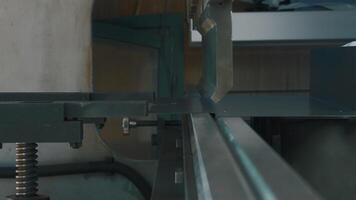 The process of metal sheet bending on a CNC bending machine. Creative. Worker hands and the equipment at the factory. video