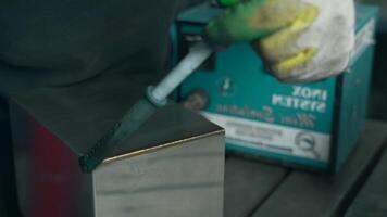 Close up of processing welds process. Creative. Worker putting protective solution against corrosion. video