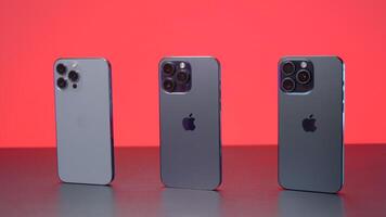 New York - September 15, 2023. iPhones of different generations in comparison. Action. Comparison of new iPhone 15 with versions 14 and 13 generations. Design of iPhones 13, 14 and 15 promax versions video